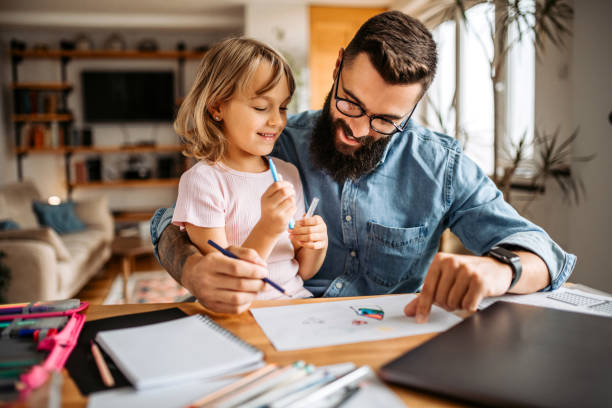 istock Assisting to daughter with homework 1347340188
