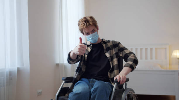 istock A young disabled man is putting on a mask on his face 1347341088