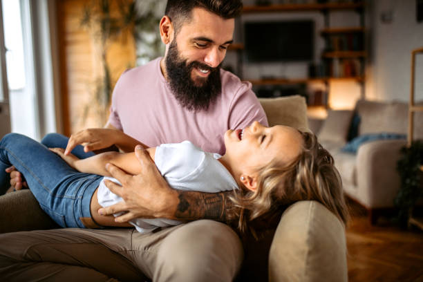 istock Father and daughter spending fun time together at home 1347343245