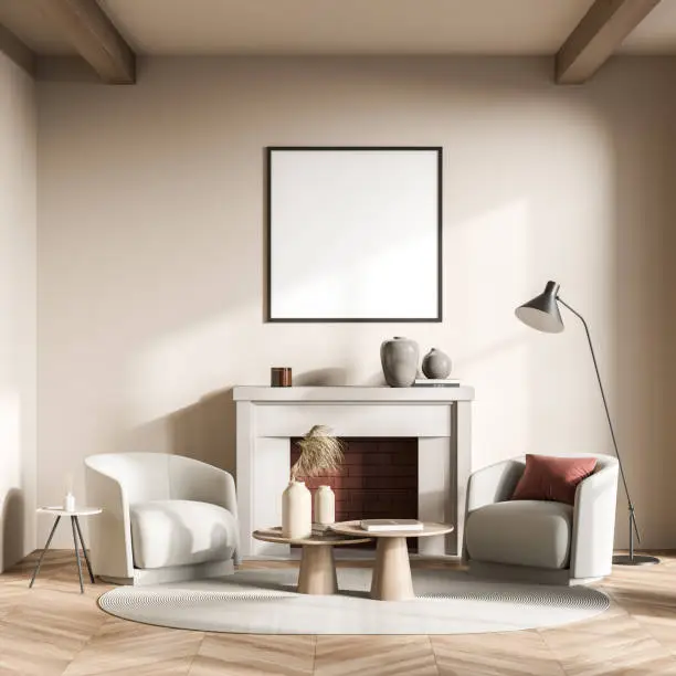 Square poster on the beige wall of the living room interior with a fireplace, two armchairs, an oval rug, coffee tables and a lamp. Parquet. Mock up. A concept of modern seating design. 3d rendering