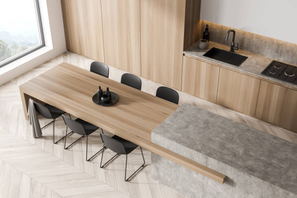 istock Modern light wood kitchen with stylish table. Top view. 1347346007
