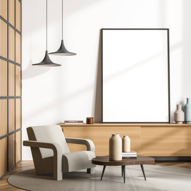 istock Single beige armchair with empty living room canvas on wood sideboard 1347346593