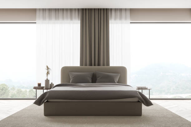 istock Beige bedroom with panoramic landscape. Frontal view. 1347347308