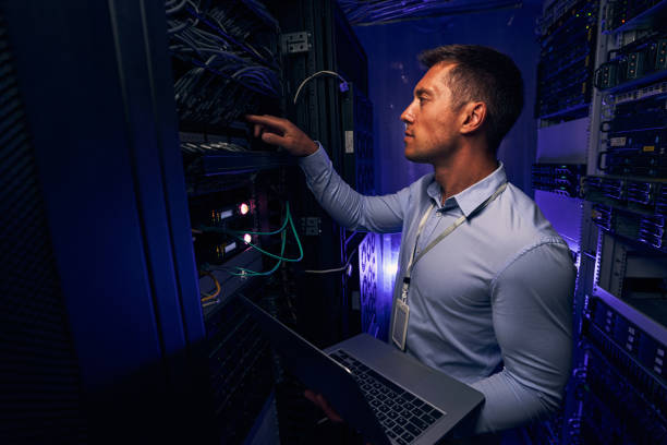 istock Experienced IT male technician monitoring server performance 1347347417