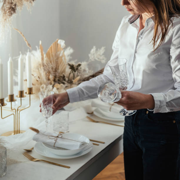 istock An Anonymous Woman Setting Up Christmas Dinner Table at Home 1347347529
