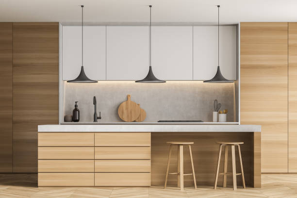 istock Wood kitchen with breakfast bar and white cabinets 1347347722