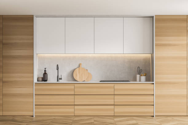 istock Stylish wooden kitchen with white upper cabinets 1347347996