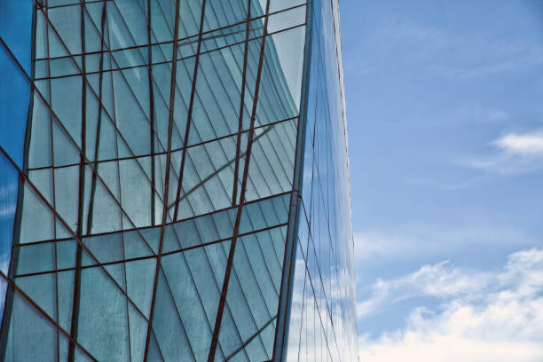 istock Beautiful reflection in modern glass wall . Building glass 1347348087