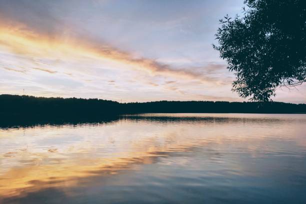 istock Beautiful sunset on the lake or river. Nature background. 1347348298