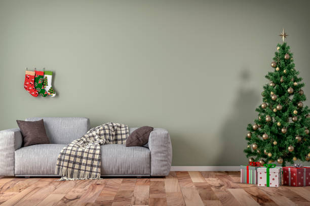 istock Empty simple living room with gray sofa, Christmas tree and gifts 1347349673