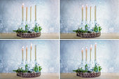 Series of four pictures with white candles from the first to the fourth Advent, glass bottles as candle holders and Christmas decoration against a light blue snowy background, copy space