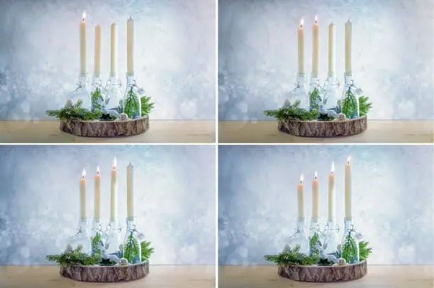 Series of four pictures with white candles from the first to the fourth Advent, glass bottles as candle holders and Christmas decoration against a light blue snowy background, copy space, selected focus
