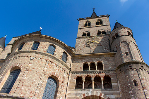 This image shows an exterior Gothic architectural view of the Liebfrauenkirche, also called the Church Of Our Lady, in Trier, Germany, which is designated a World Heritage Site.