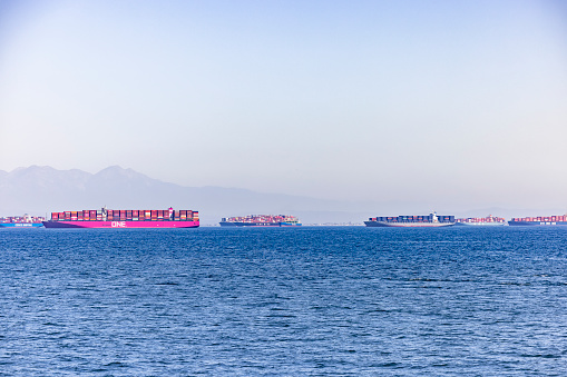 Container ships line the Port of Long Beach causing  long shipping delays amidst a global supply chain disruption threatening cargo and freight cargo ships ahead of holiday shopping season.