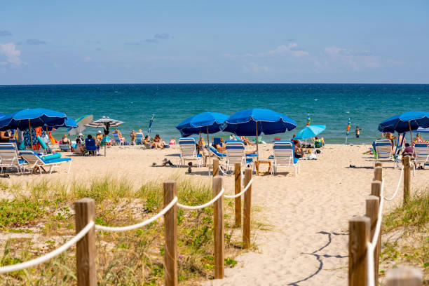 Blue umbrellas on the beach Delray Beach, FL, USA - October 17, 2021: Blue umbrellas on the beach delray beach fl stock pictures, royalty-free photos & images