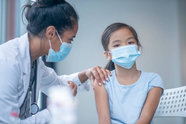 istock Young Girl Receiving a Vaccination 1347369485