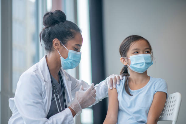 istock Young Girl Receiving a Vaccination 1347369518