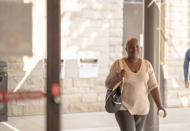 istock Senior Woman Entering a Community Center 1347369834