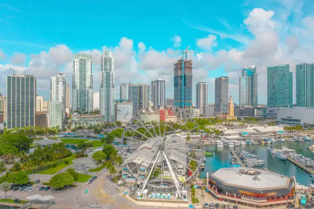 Photo of View of Bayside Marketplace in Miami, Florida with ferris wheel, boats, and beautiful skyline in frame