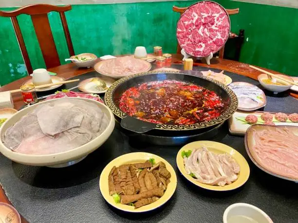 Chongqing is one of the origin place of popular Chinese hotpot. Here are the images of traditional Chongqing Hotpot. The dishes includ beef, mutton, chicken, fish and edible animal organs.