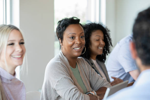 istock Diverse group of professional women attend training workshop together 1347384480