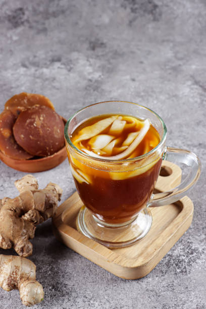 istock Wedang Bandrek kelapa muda is a traditional drink from West Java, Indonesia, made from ginger, brown sugar, spices and young coconuts. 1347388780