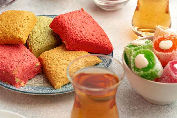 istock Various Turkish sweets and cup of tea on white textured background 1347390133