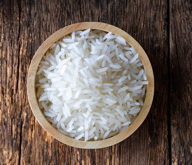 istock rice in wood bowl on wood 1347393395