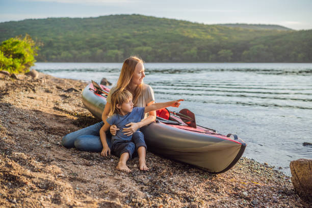istock Happy mom and son are ready for kayaking 1347394240