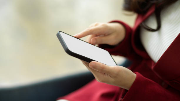 istock Close-up Female manager using smart mobile phone to checking online website pages. 1347395606