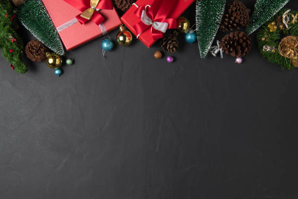 istock Christmas background with red gift and fir tree and decor. Top view 1347395749