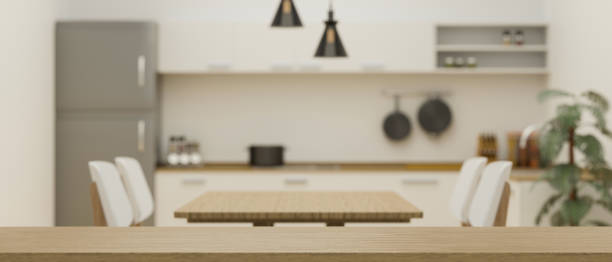 istock Empty space on wooden board for montage on blurred minimalist kitchen and dining room interior 1347395925