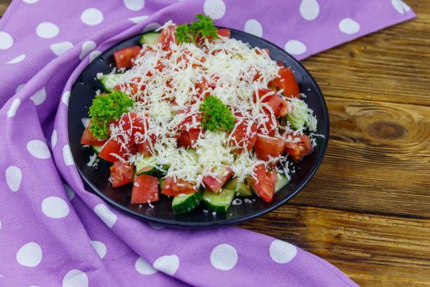 istock Traditional Bulgarian Shopska salad on wooden table 1347403715