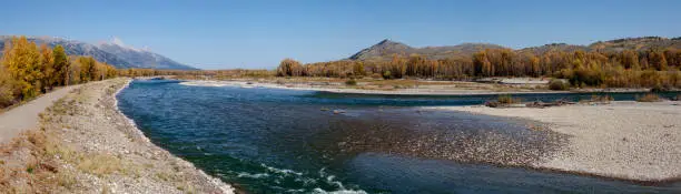 Snake River at intersection of Hwys 22 and 390 near town of Jackson, Wy in the Jackson Hole valley.  Located not far from Grand Teton National Park. Address is listed as Wilson, Wyoming. Panoramic. Edited.
