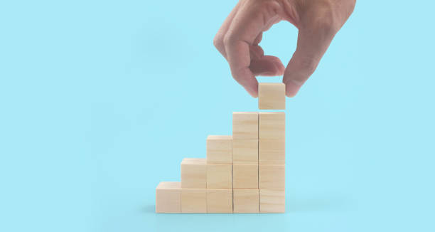 istock Wooden blocks chart steps with copy space. The business growth process 1347405904