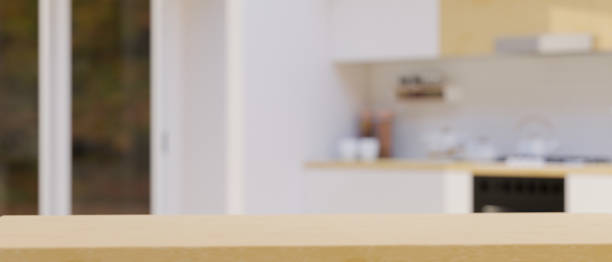 istock Copy space on wooden tabletop for montage over blurred modern apartment kitchen space 1347409303