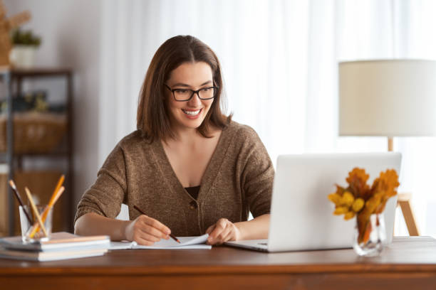 istock young woman working at home 1347410774