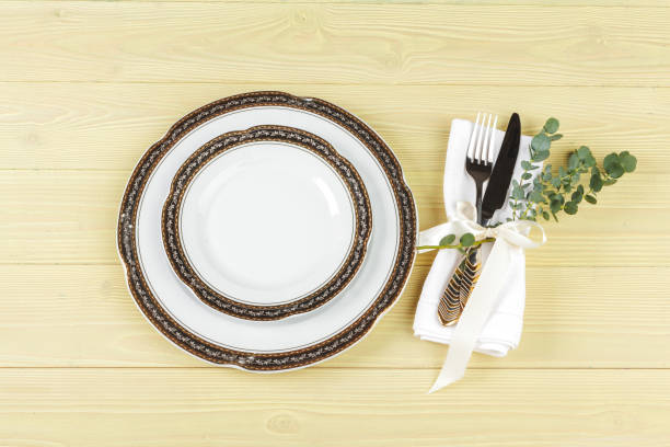 istock Table with plates and cutlery, view from above 1347411364