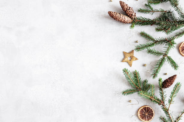 istock Christmas composition. Fir tree branches, christmas golden decorations on gray background. Flat lay, top view, copy space 1347411438