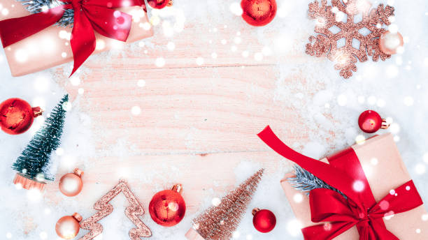 istock Christmas frame. Winter wooden decoration background. Xmas board with old rustic wall, white frozen snow, golden balls and gift box. Top view with copy space. 1347412481