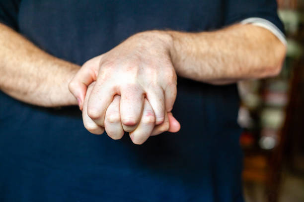 istock both hands of caucasian man in dark background 1347416448
