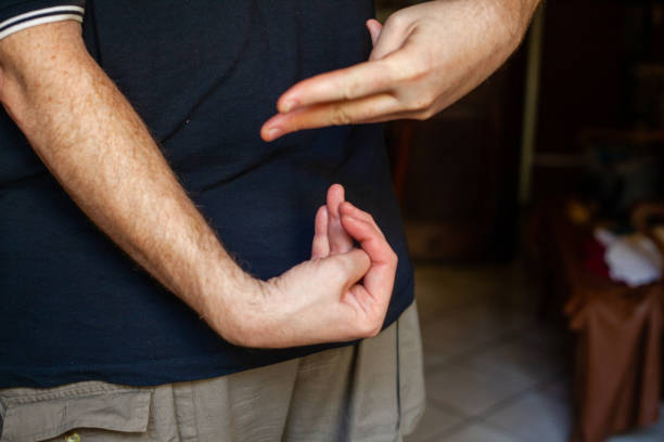 istock both hands of caucasian man in dark background 1347416466