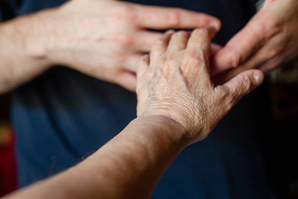 istock both hands of caucasian man in dark background 1347416474