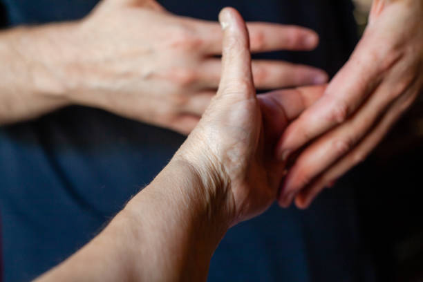 istock both hands of caucasian man in dark background 1347416480