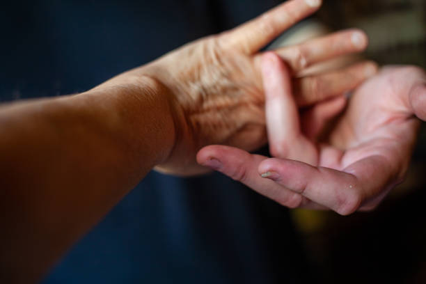 istock both hands of caucasian man in dark background 1347416493