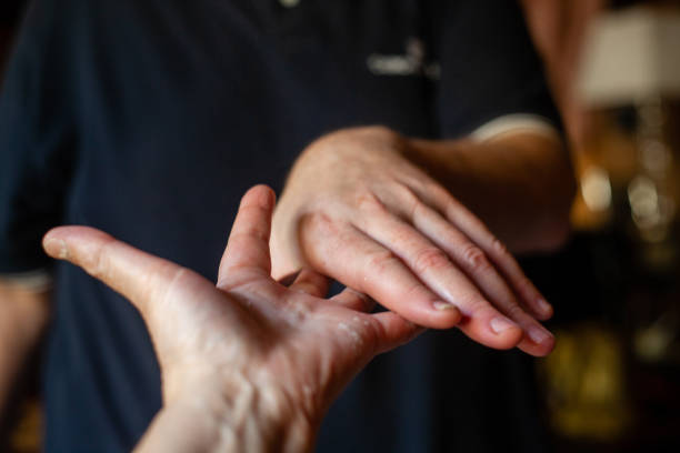 istock both hands of caucasian man in dark background 1347416503