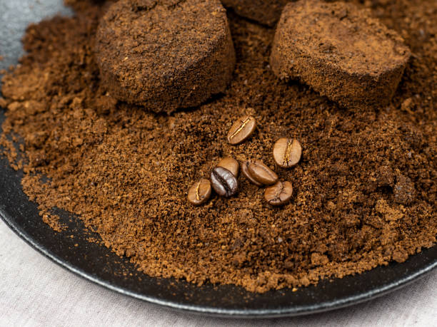 istock Used coffee grounds from the coffee machine. Natural coffee cake on a light background. Eco-friendly and waste-free concept. 1347416696