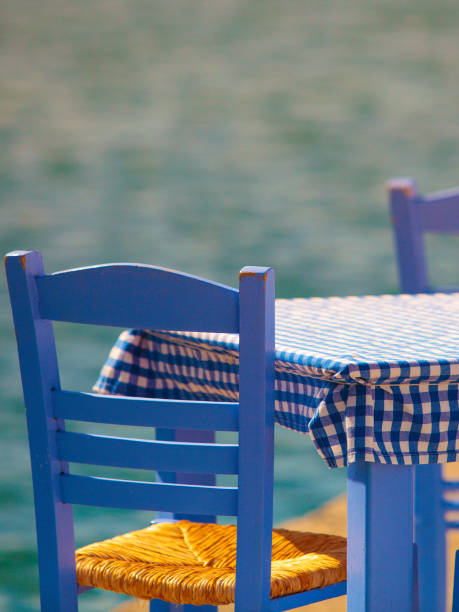 istock Open cafe outdoor restaurant in Greece on sea shore 1347417114