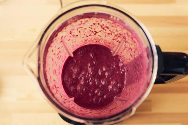 istock Above shot of electric blender with fruit smoothie 1347417871