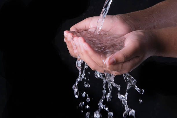 istock Pouring water splashing on hand 1347418896